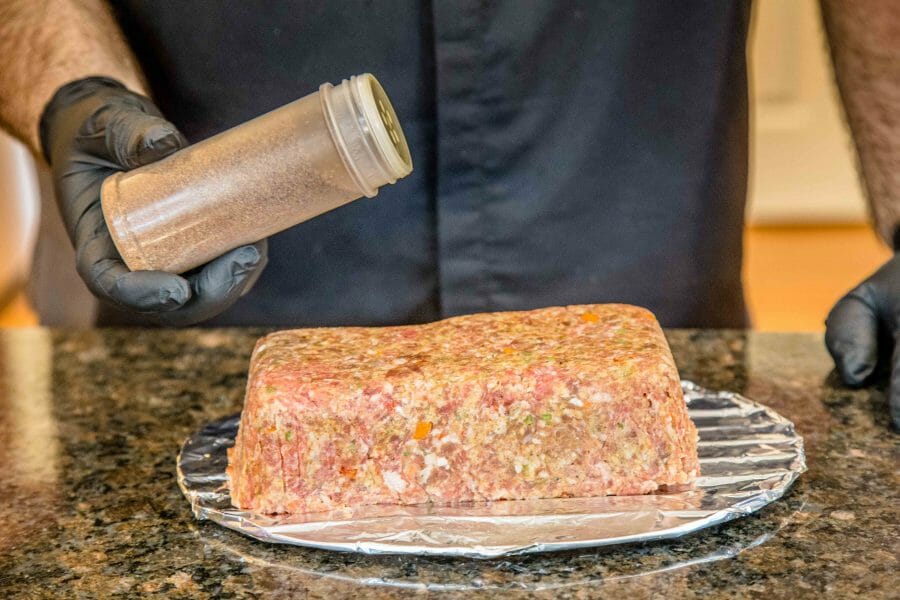 seasoning the meatloaf on a wire rack