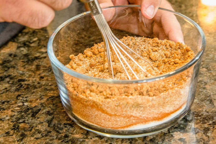 mixing dry rub with a whisk