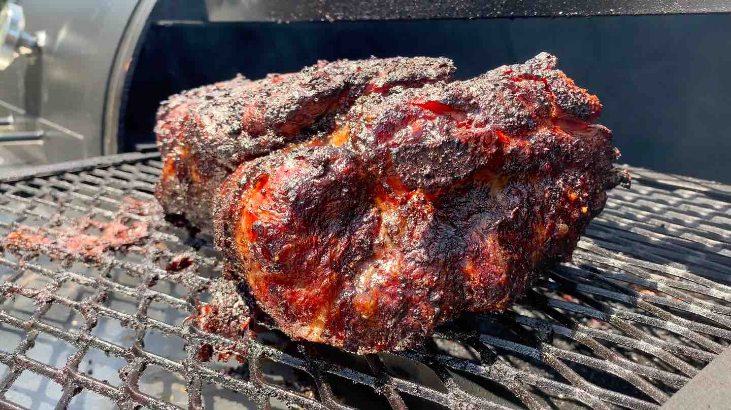 pork butt smoking on an offset smoker