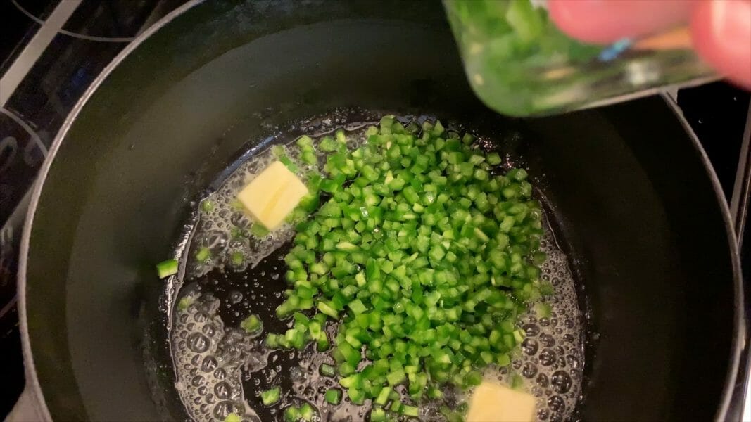 butter and diced jalapenos in dutch oven