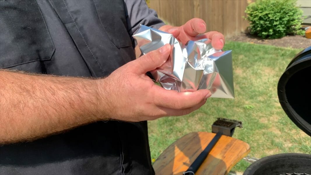 crumpling aluminum foil into a ball