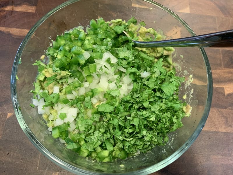 adding onion, jalapeno, and cilantro