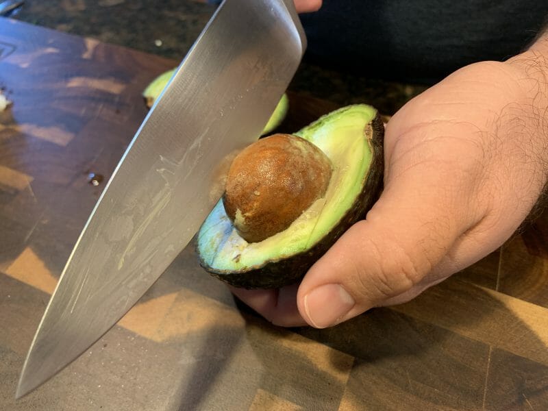 removing the pit of an avocado