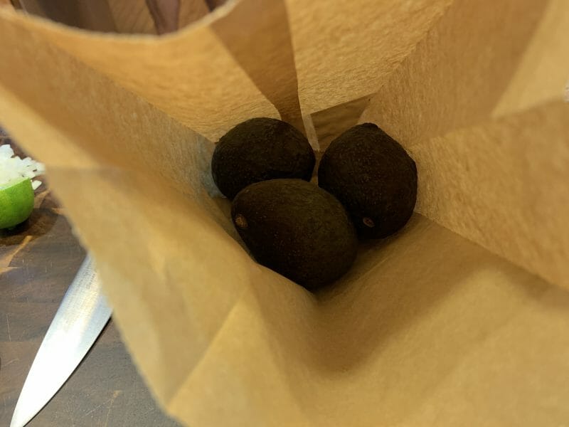 ripening avocados in a brown bag