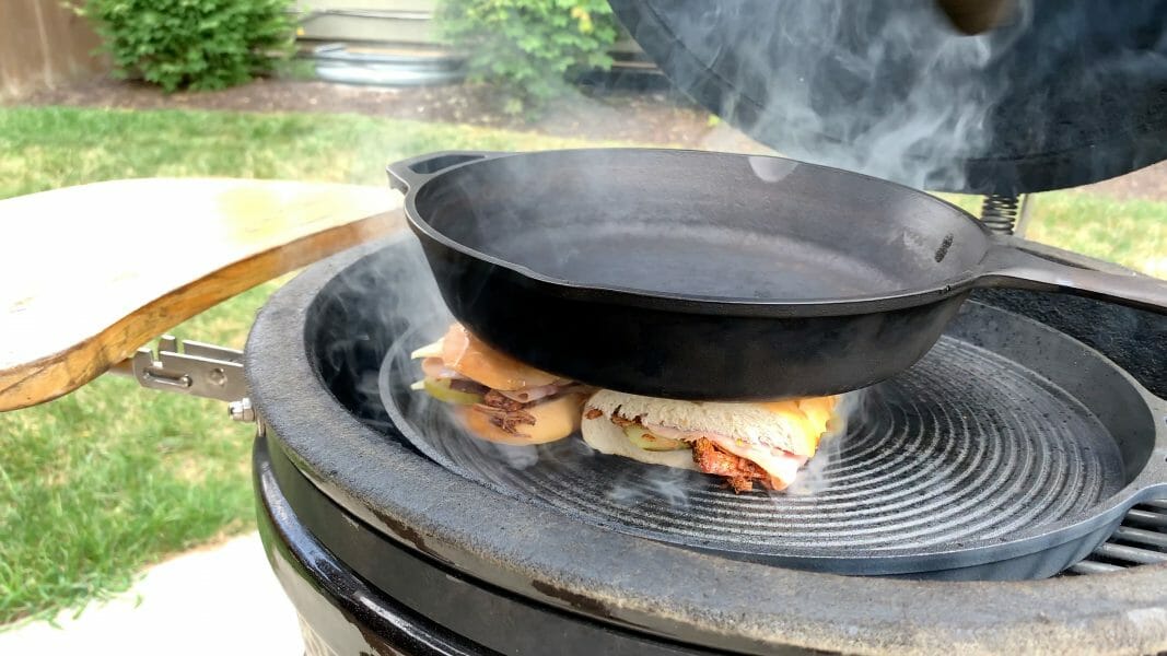 pressing cubano recipe between two cast iron pans