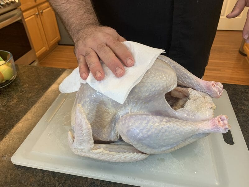 drying the turkey with a paper towel