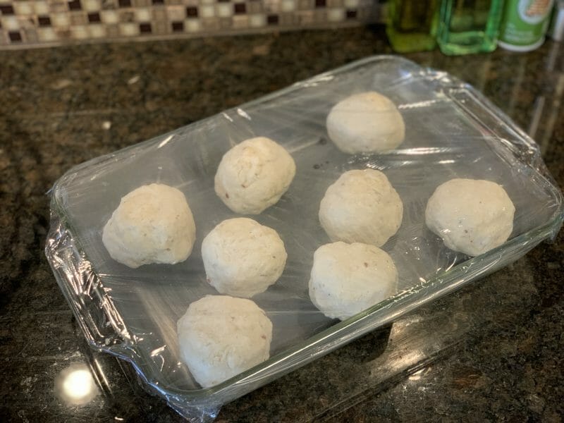 grilled pizza dough balls getting ready to rise