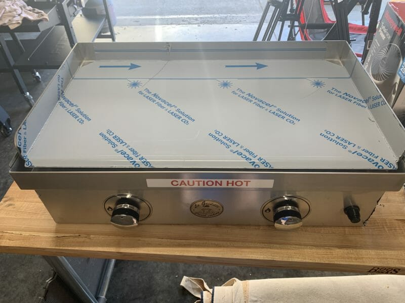 unboxed Le Griddle with adhesive protection on stainless steel