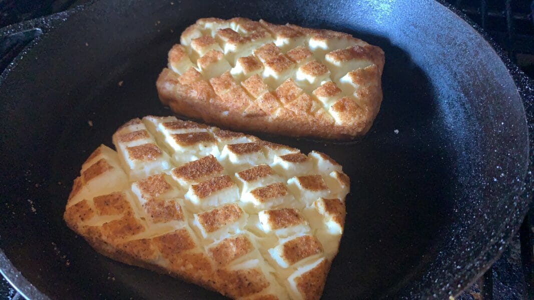 sweet and savory smoked cream cheese in a cast iron pan