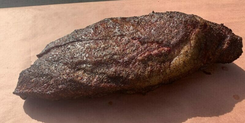 smoked brisket about to be wrapped in butcher paper