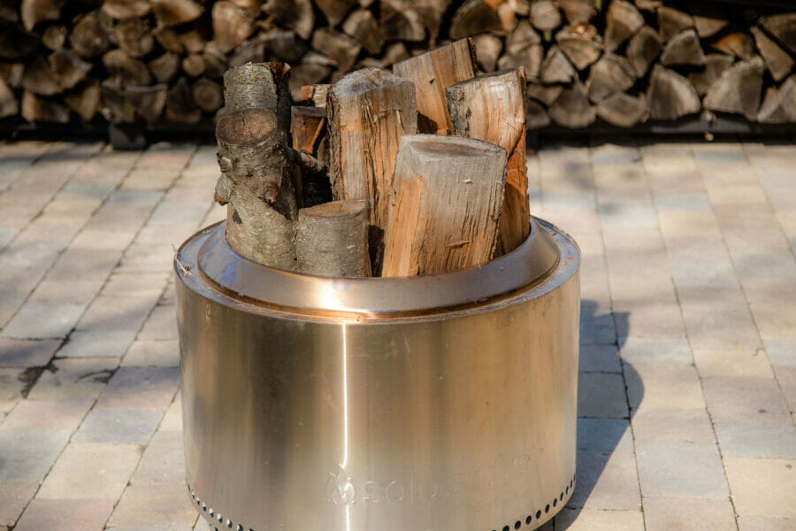 Solo Stove Yukon fire pit loaded with wood