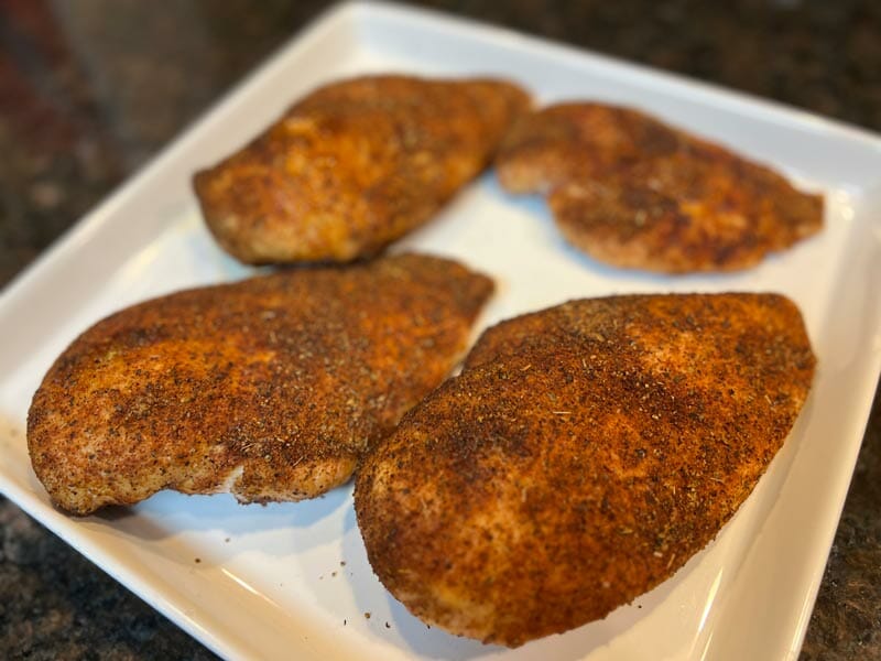 smoked chicken breasts on a plate