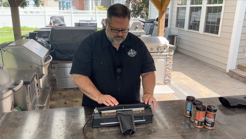 David sealing an 8 oz Mylar bag of Barbecue seasoning