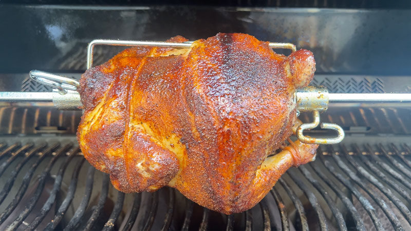 Chicken cooking on the included rotisserie in the Napoleon prestige 500 Connected