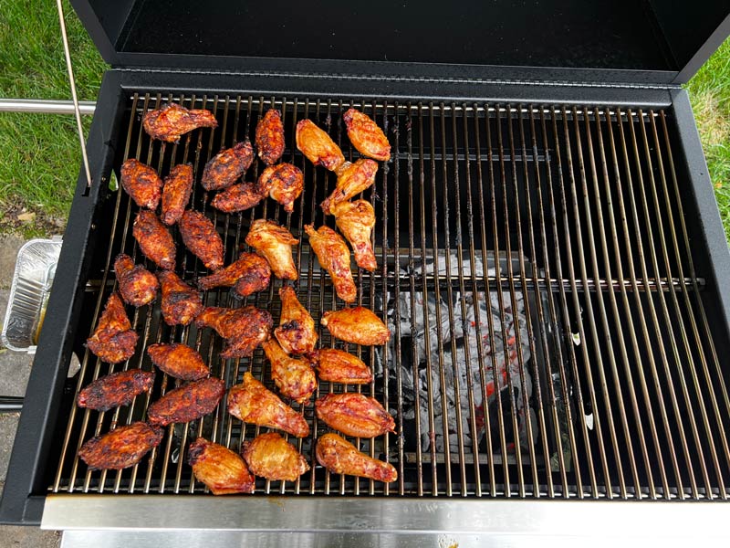 there is plenty of cooking space for chicken wings cooking hot and fast on the left side of the Hasty Bake Legacy