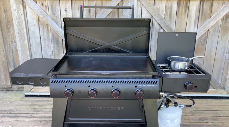 a pot of water coming to a boil on the camp chef gridiron 36 Pro side kick burner