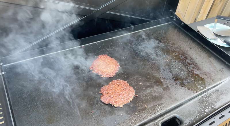 smash burgers cooked on the camp chef gridiron 36 pro flat top