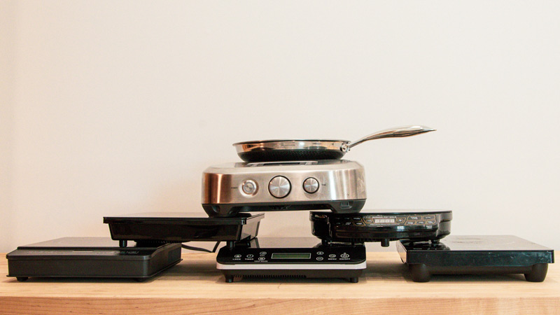 induction-burners-2 6 portable induction cooktop models stacked on a counter top