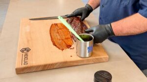 paint bbq sauce on the cutting board before flipping them bone side up to cut