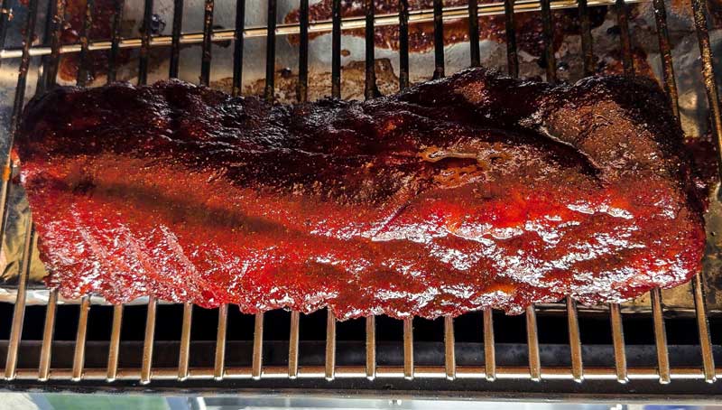 fall off the bone ribs recipe seasoned with dry rub and glazed in bbq sauce