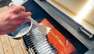 basting the smoking ribs with melted butter