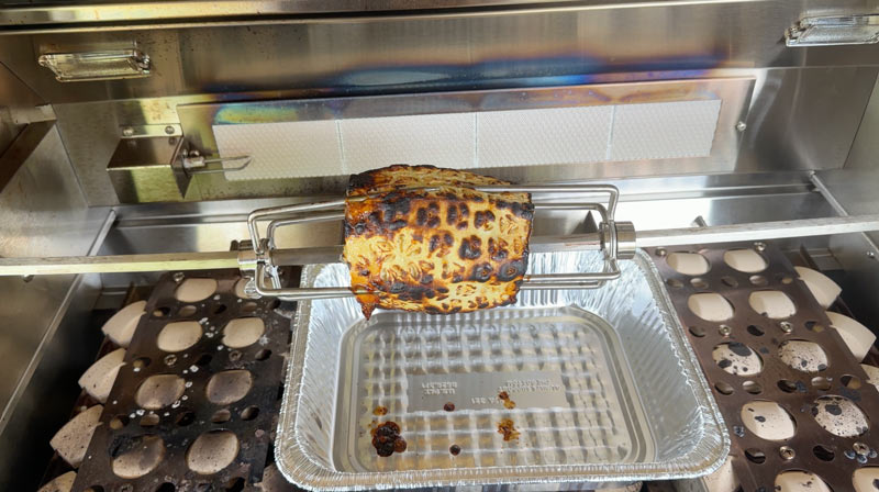 The RCS cutlass elite includes a Ceramic Infrared Back Burner and rotisserie where we cooked a pineapple
