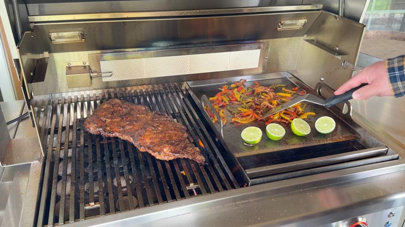 using the griddle insert to cook steak fajitas during our RCS cutlass elite review video