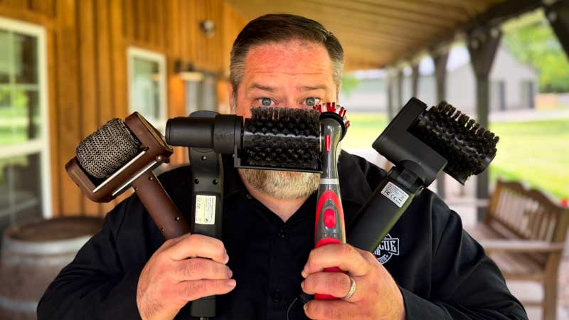 David holding 4 electric grill grate cleaners from Amazon