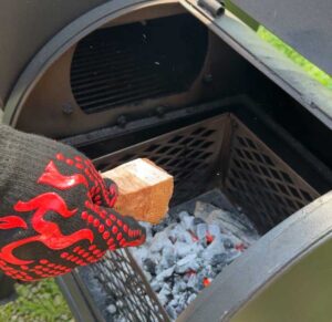 adding a chunk of cherry wood to the offset firebox