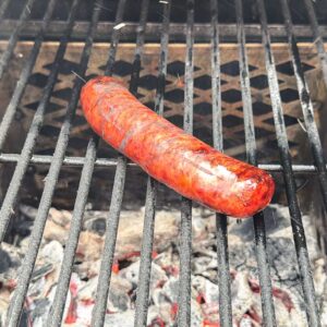 searing smoked brats over charcoal in an offset smoker firebox