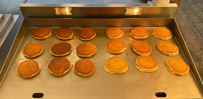 18 pancakes cooked across the stainless steel cooking surface of the new Le Griddle Pro Series 75